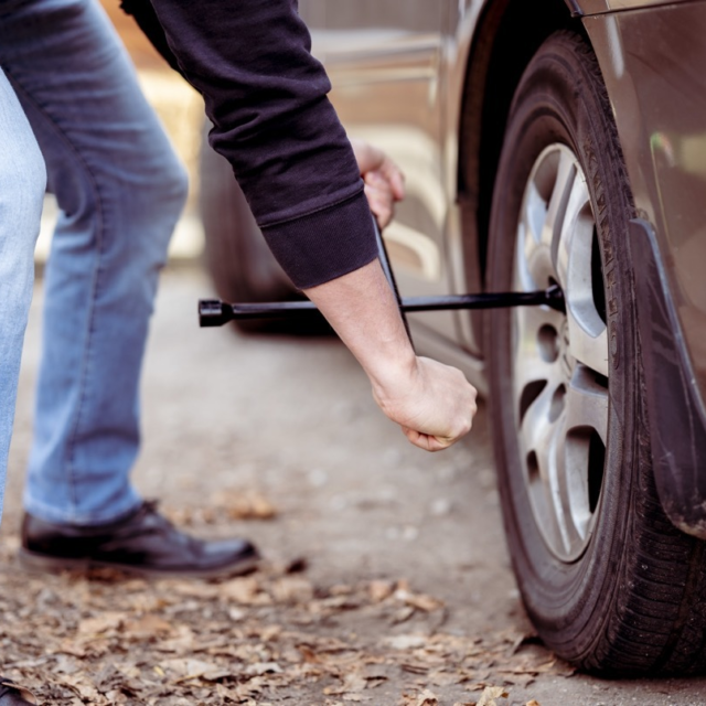 Closeup shot of a man repairing a wheel with a too 2025 02 06 02 51 56 utc