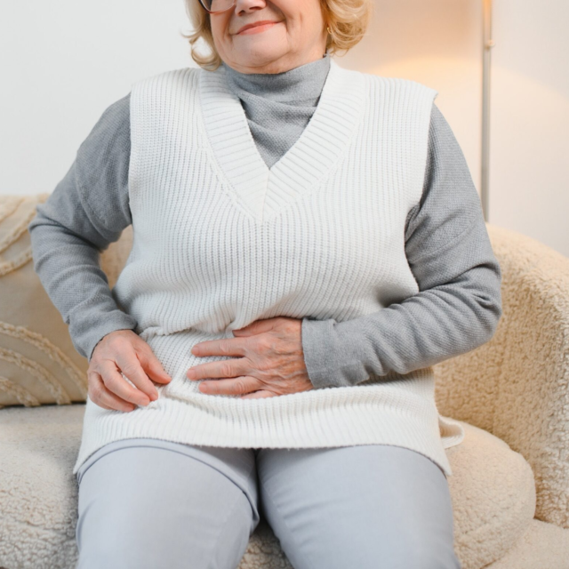 Elderly senior woman stomach ache illness food po 2025 03 15 15 29 03 utc